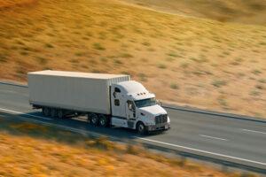 Big White Truck Running on the Highway — Waukegan, IL — Daniels, Long & Pinsel, LLC